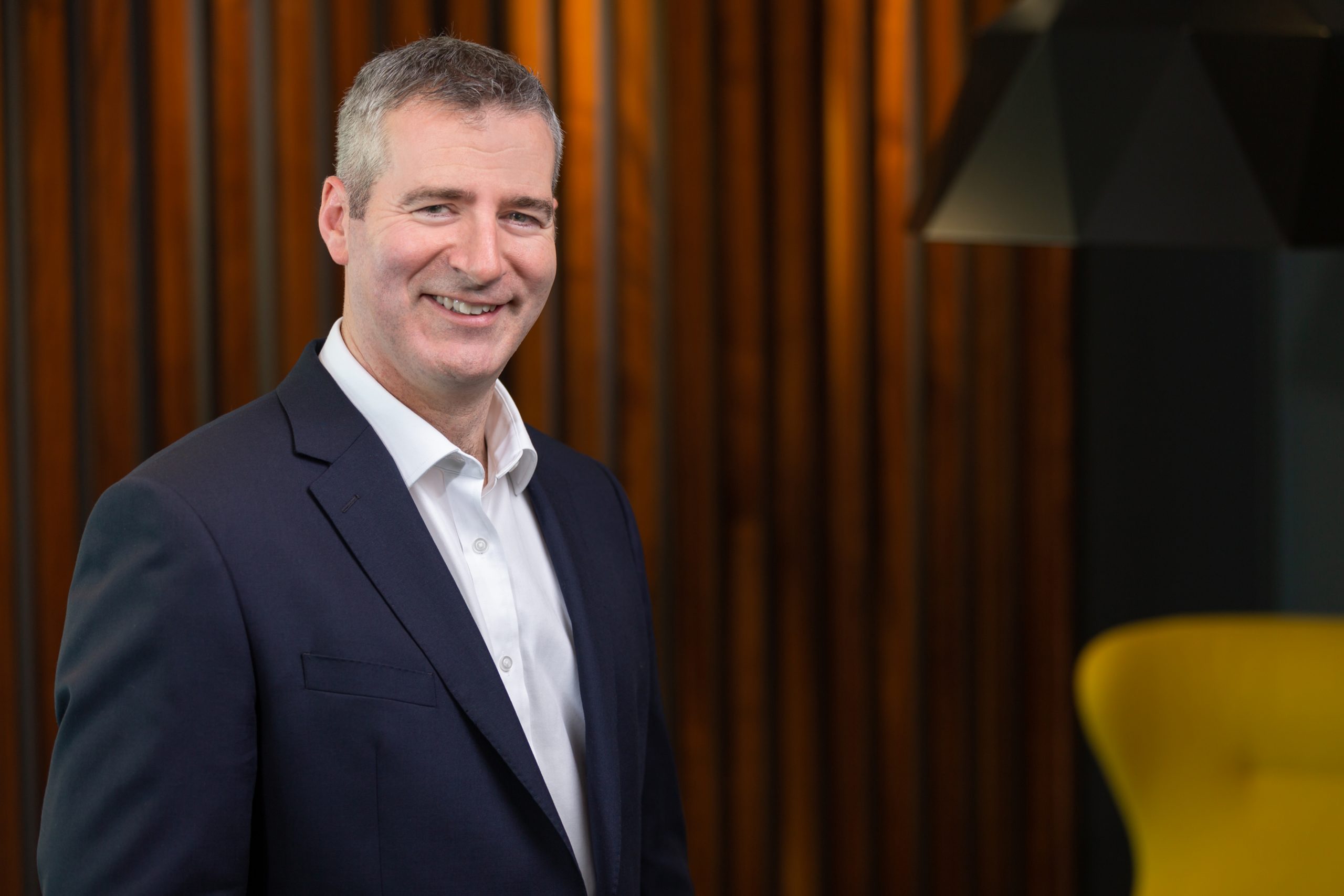 Corporate-Boardroom-Headshot Director-relaxed-brand-headshot