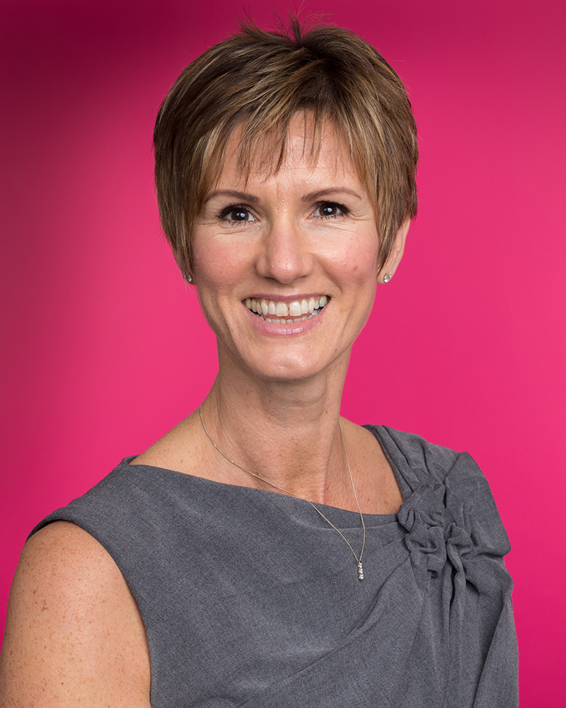 Woman-Headshot-Pink-Background